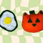 Felt patch shaped like a fried egg and an orange felt cat pumpkin plushie