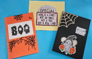 orange card with BOO and webs, yellow card with Special and message, black card with mouse and web