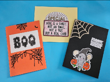 orange card with BOO and webs, yellow card with Special and message, black card with mouse and web