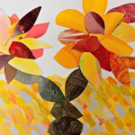 Paper collage craft with autumn leaf cutouts.