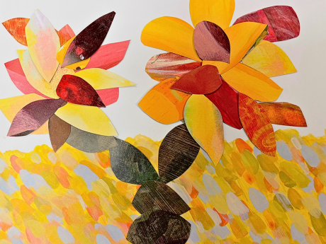 Paper collage craft with autumn leaf cutouts.