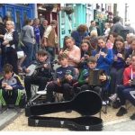 Photo of a street performance of celtic music.