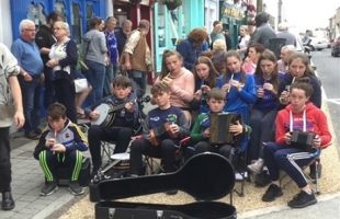 Photo of a street performance of celtic music.