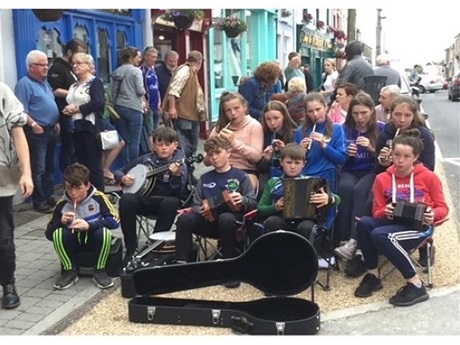 Photo of a street performance of celtic music.