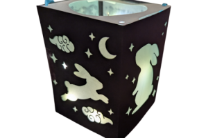 black rectangular lantern with cutout rabbit shapes