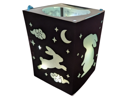 black rectangular lantern with cutout rabbit shapes