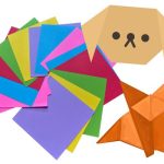 Colorful origami sheets and a dog and fox origami.