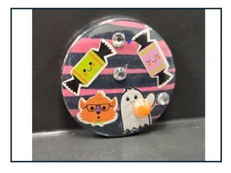 button decorated with candy and ghosts